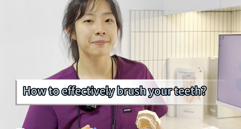 Dr Grace Ho explaining the way to effectively brush your teeth