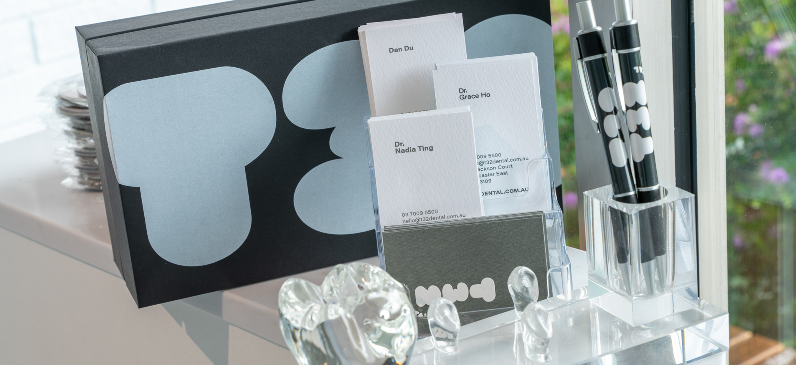 T32 Dental business cards and branded desk items.