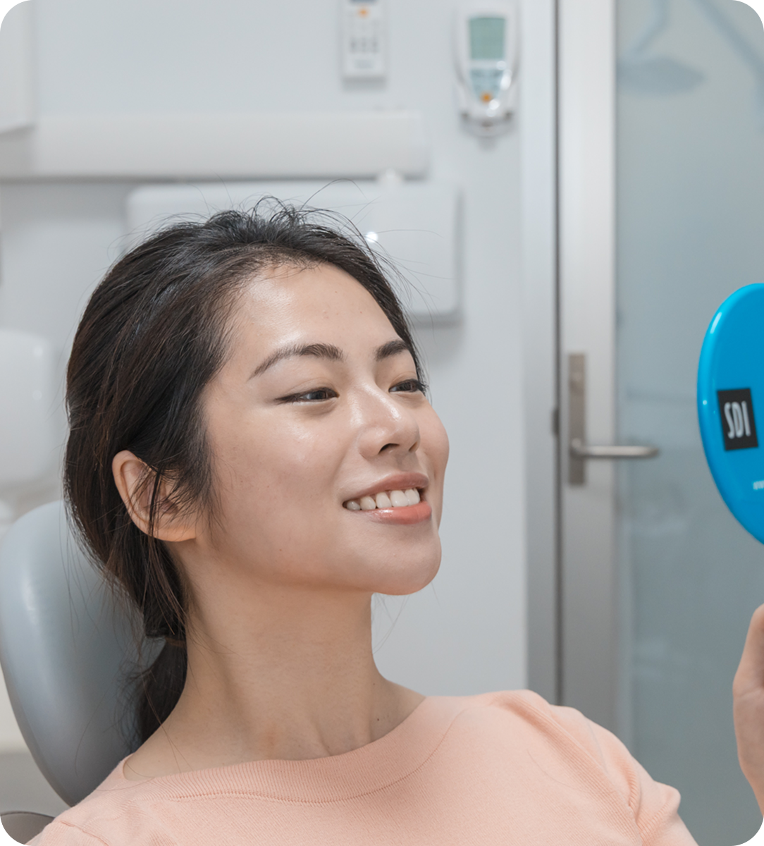 Patient's smile and healthy tooth in T32 Dental after receiving personal care.