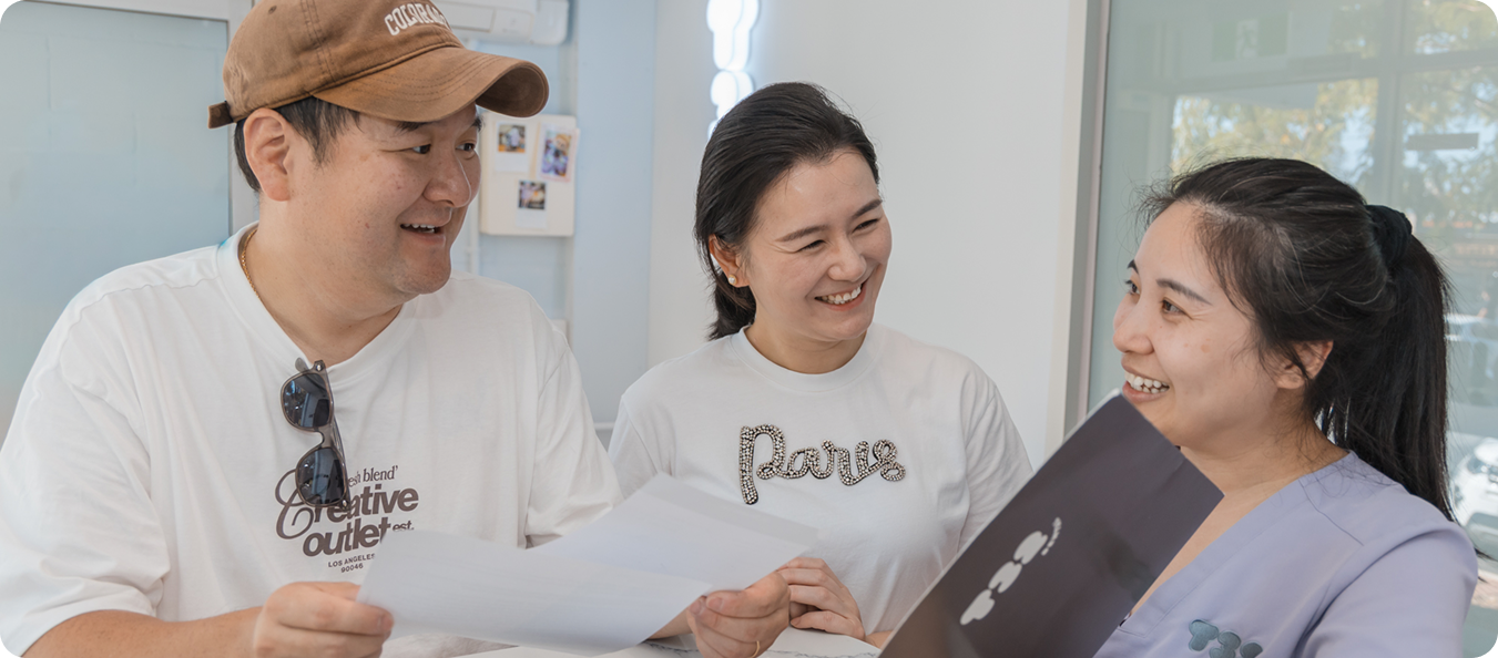 Smiling patients feeling comfortable and cared for with their friendly dentists at T32 Dental.