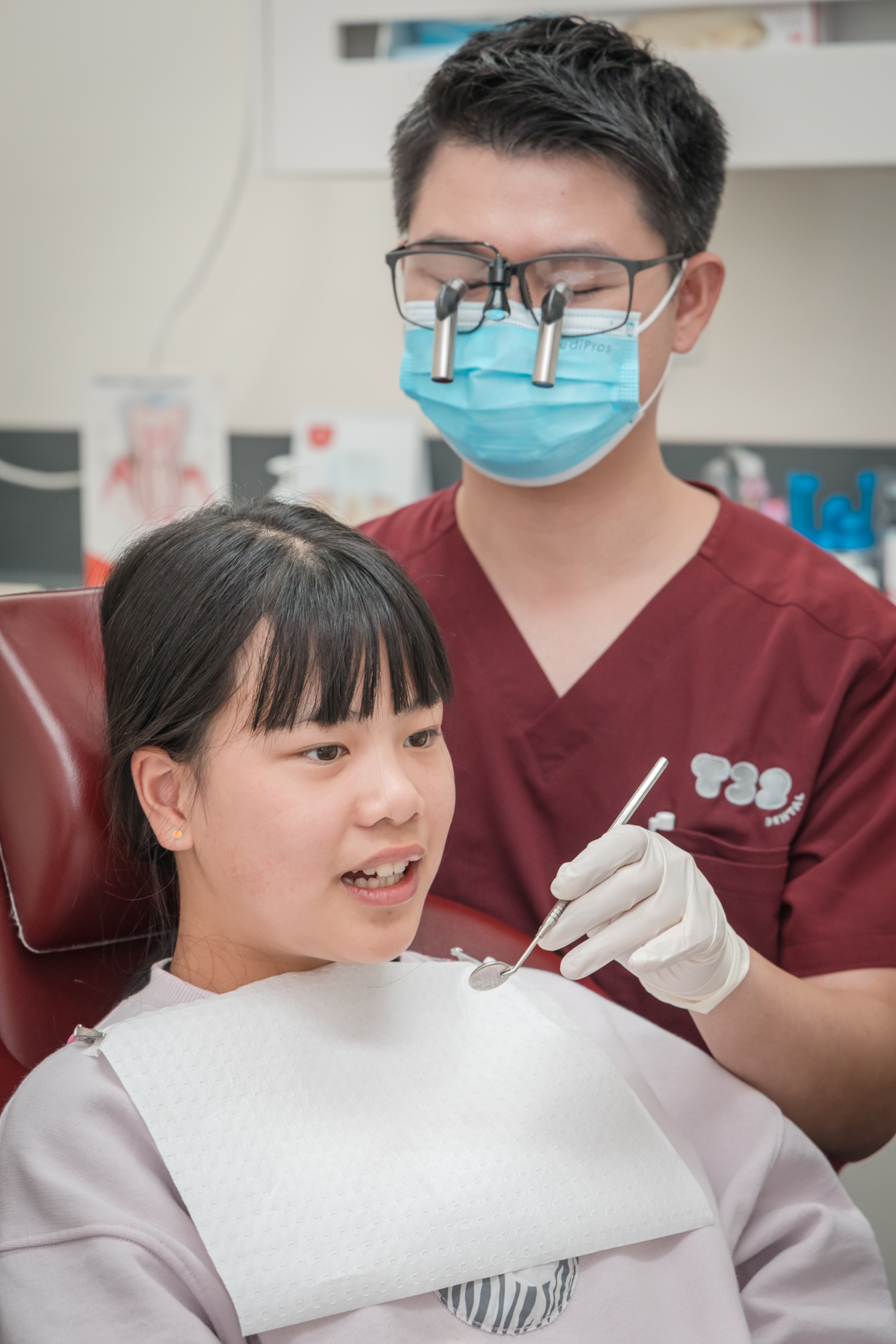 A dental checkup assessing the front teeth before a composite veneers procedure.