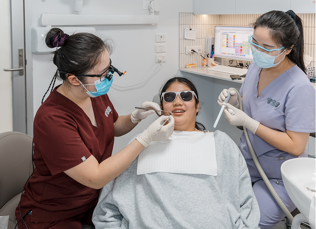 Patient getting a dental checkup to prepare for custom-fit protective mouthguards.