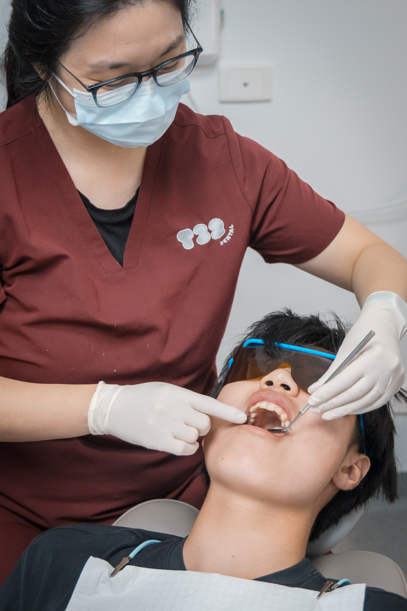 A dental examination of natural teeth to determine the fit and preparation needed for custom dentures.